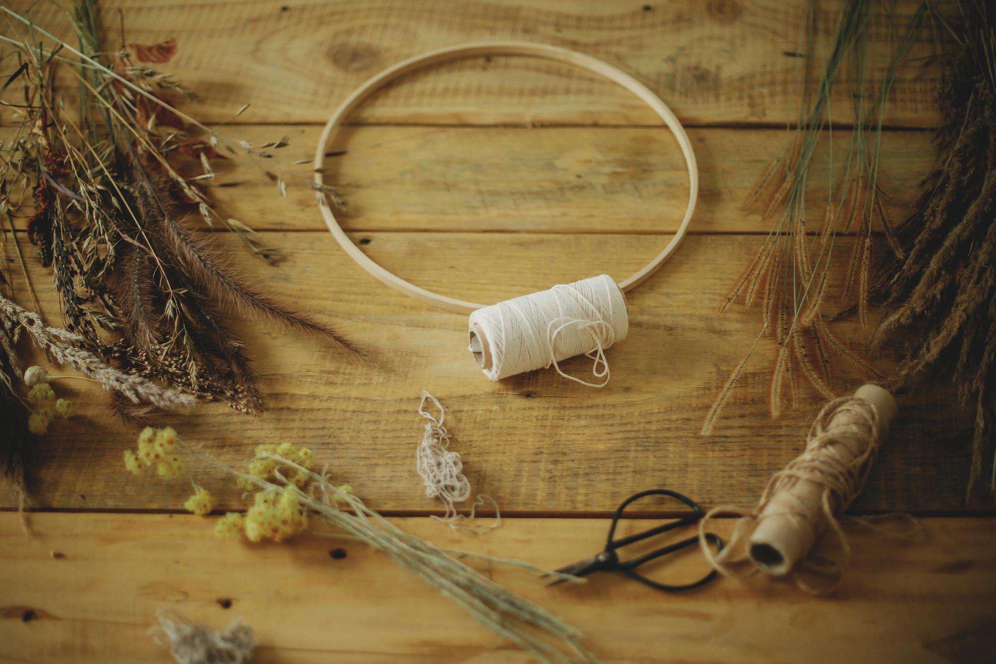 workbench with embroidery hoop and tools